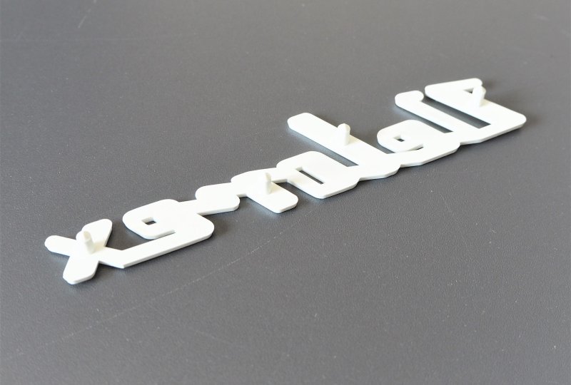 Emblemat VELOREX, plastik, biały-photo2