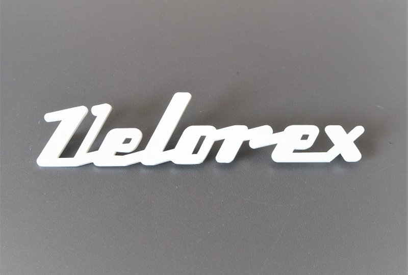 Emblemat VELOREX, plastik, biały-photo1
