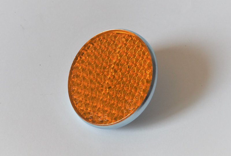 Odblask pomarańczowy, ocynkowana ramka, ze śrubką, 57 mm, plastik, Jawa, CZ-photo1