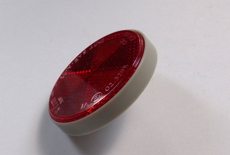 Odblask czerwony, ze śrubką, 59 mm, szara ramka, plastik, Jawa, CZ-photo2