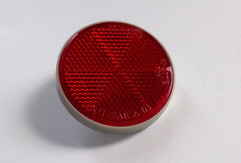 Odblask czerwony, ze śrubką, 59 mm, szara ramka, plastik, Jawa, CZ-photo1